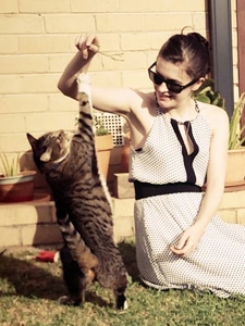 Maria playing with cat