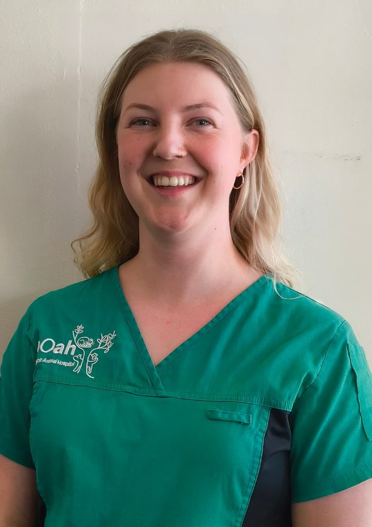 Tayla Keene smiling in NOAH vet uniform